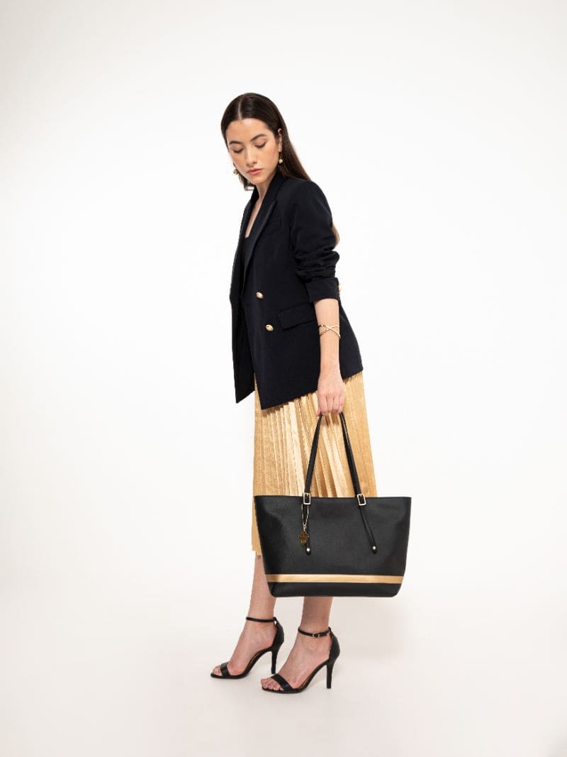Minerva black plant leather tote bag styled with outfit showing everyday fashion and work use