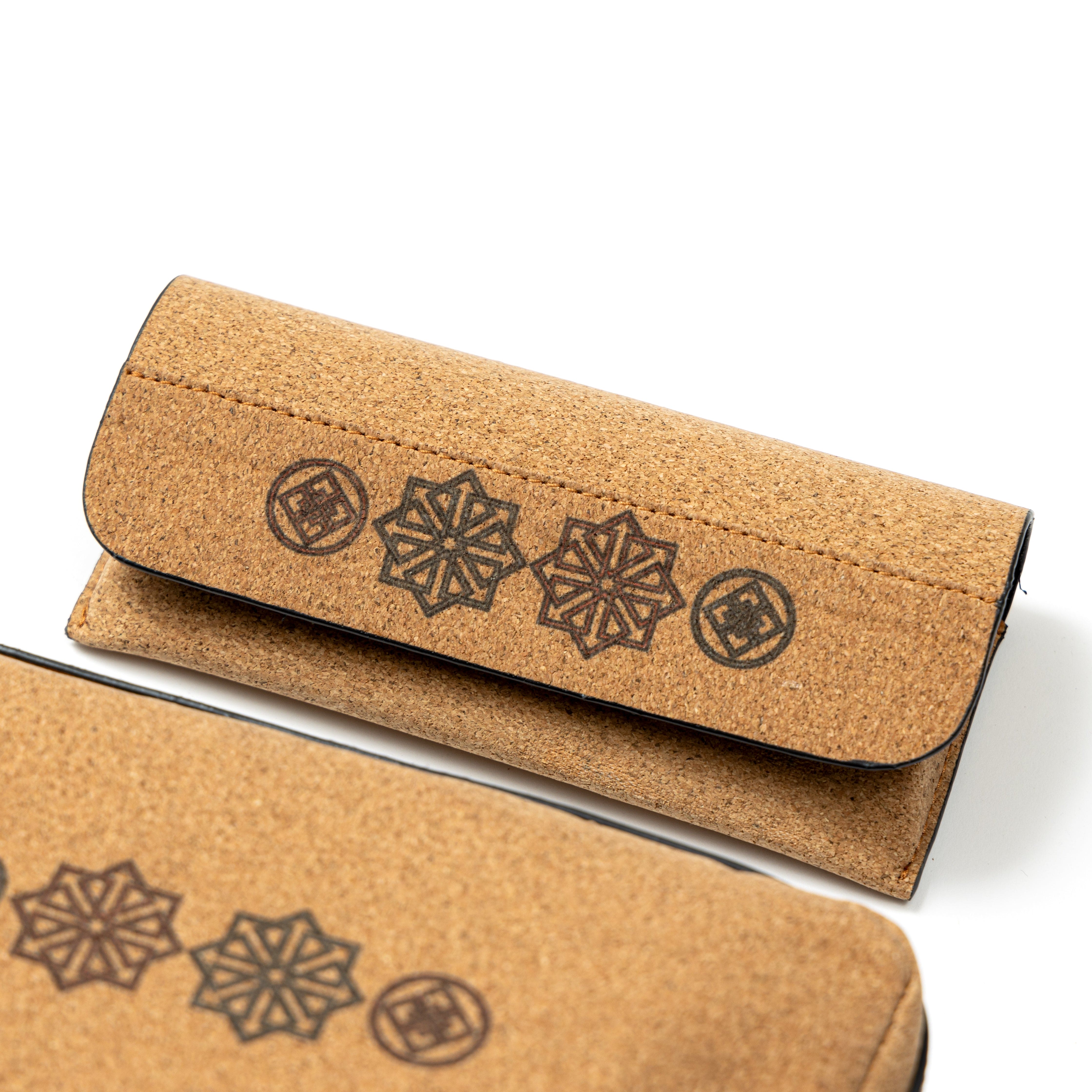 Open plant leather eyewear case from the Noir Holiday Travel Set by Green Hermitage with cork exterior and geometric design