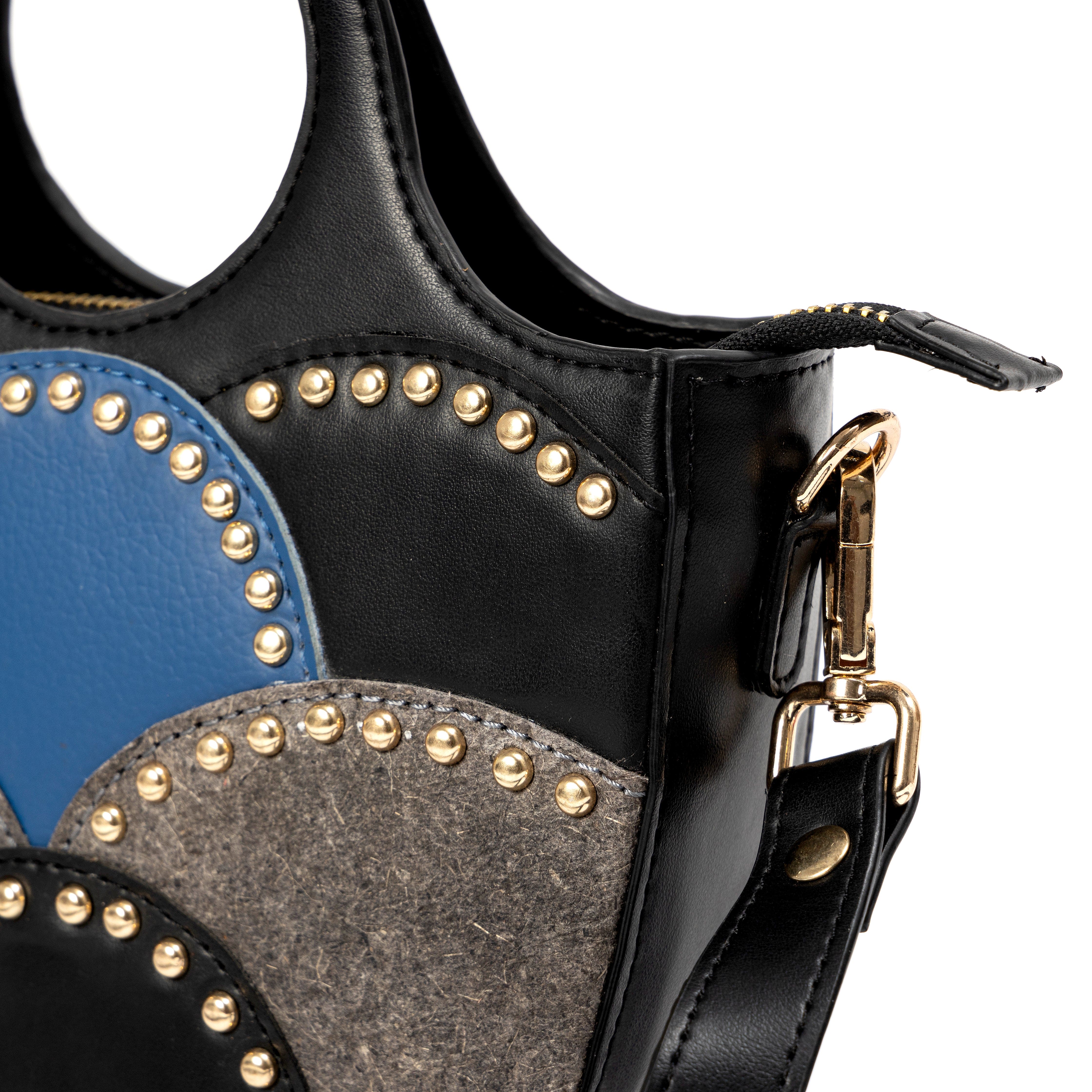 Close up detail of Savannah Black plant leather sling bag showing studded geometric design and hardware by Green Hermitage