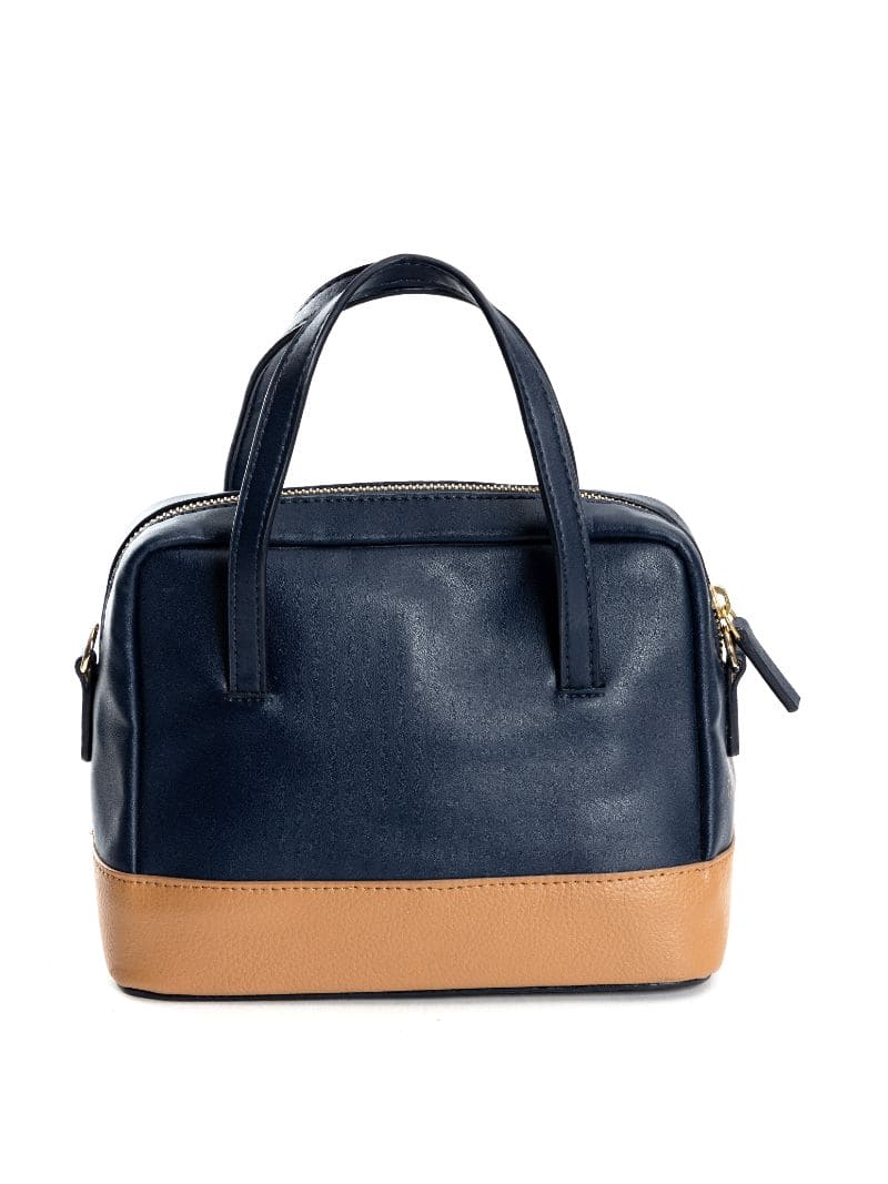 Back view of navy blue and caramel plant leather satchel crossbody bag on a clean background, highlighting structure, stitching, and rear design