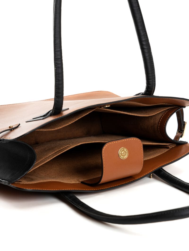 Interior view of Aranyani plant-based leather tote bag in gingerbread and black colour showing compartments, inner pockets, and organised storage design