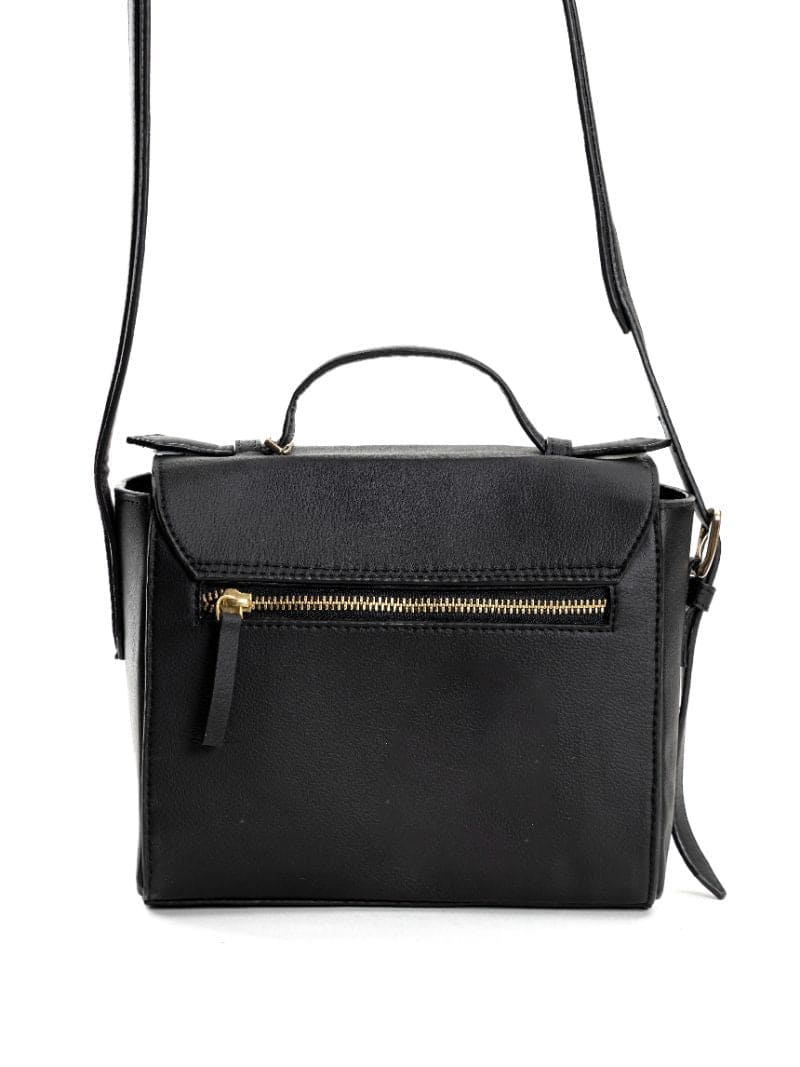 Back view of Asteria black plant-based leather crossbody bag showing zip pocket and structured design with adjustable strap