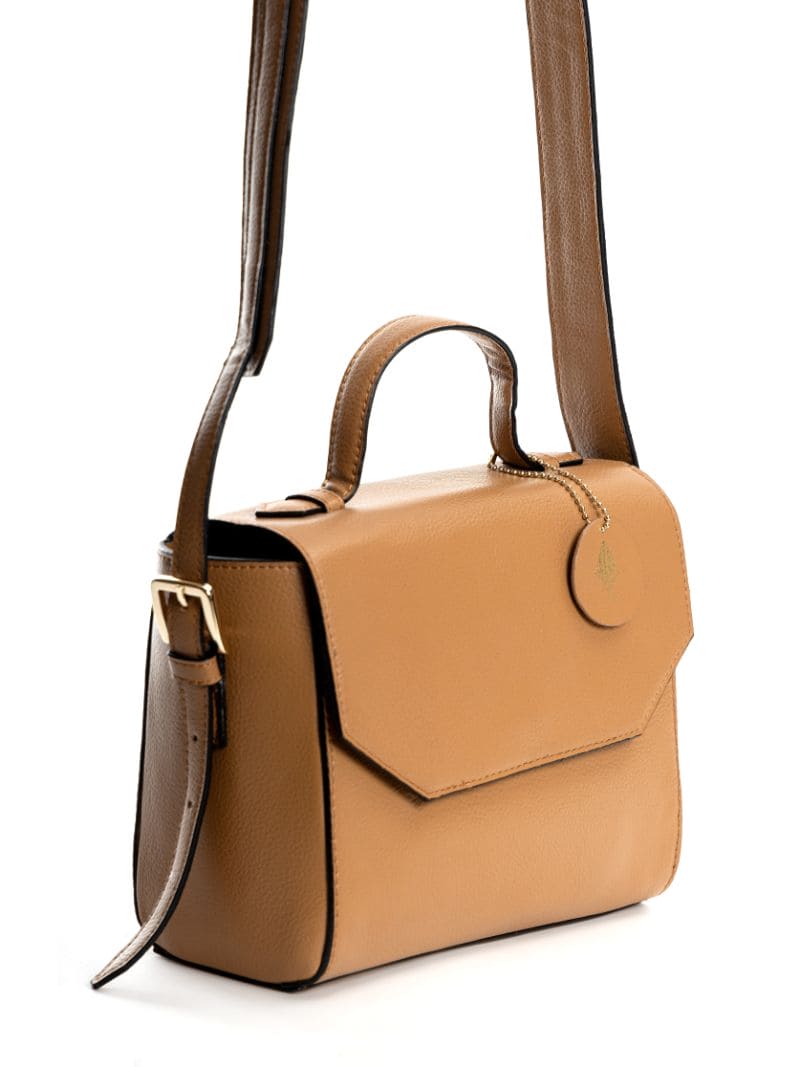 Asteria caramel vegan leather crossbody bag side angle view showing structured silhouette, top handle and adjustable strap