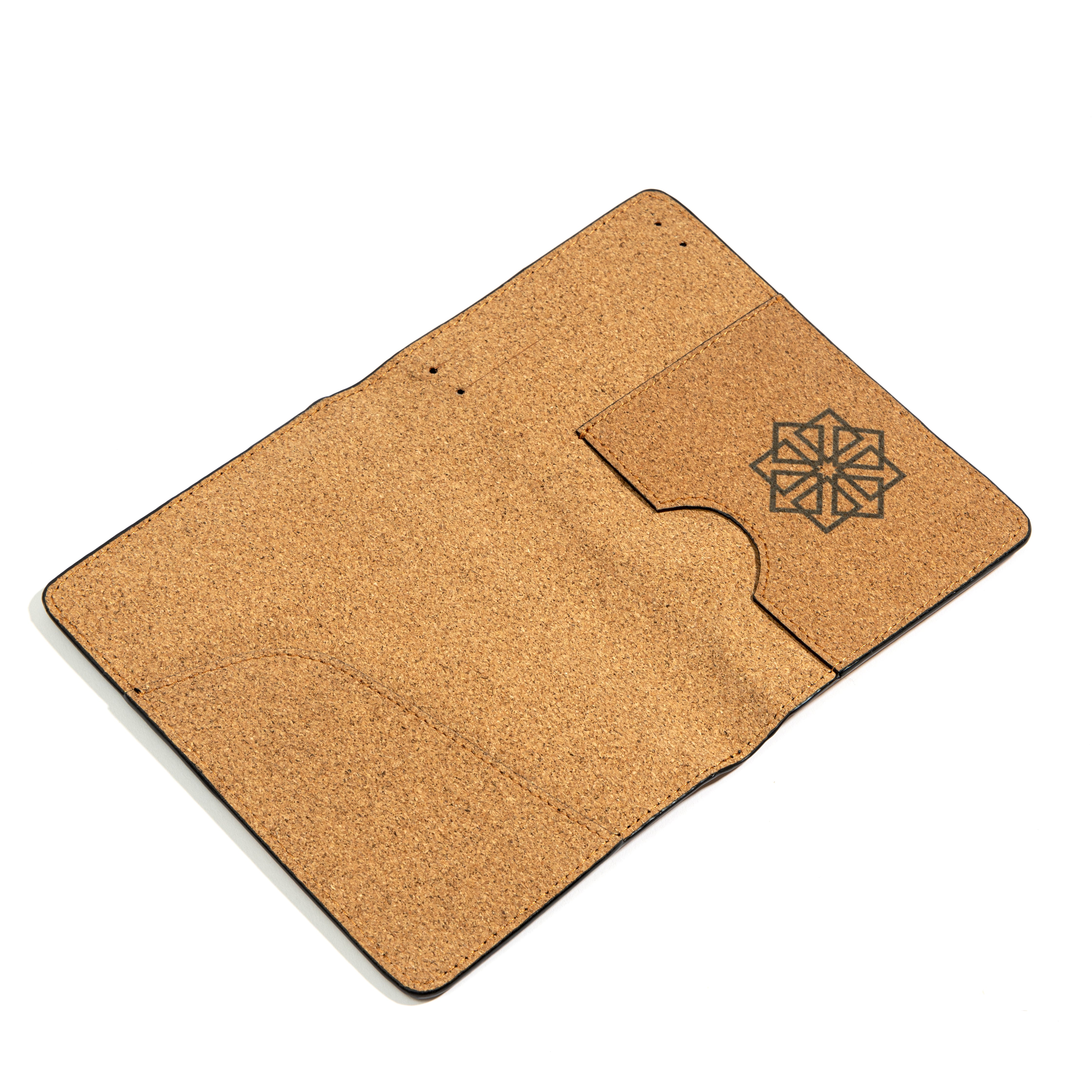Open plant leather passport holder from the Noir Holiday Travel Set by Green Hermitage showing interior card slots and passport compartment