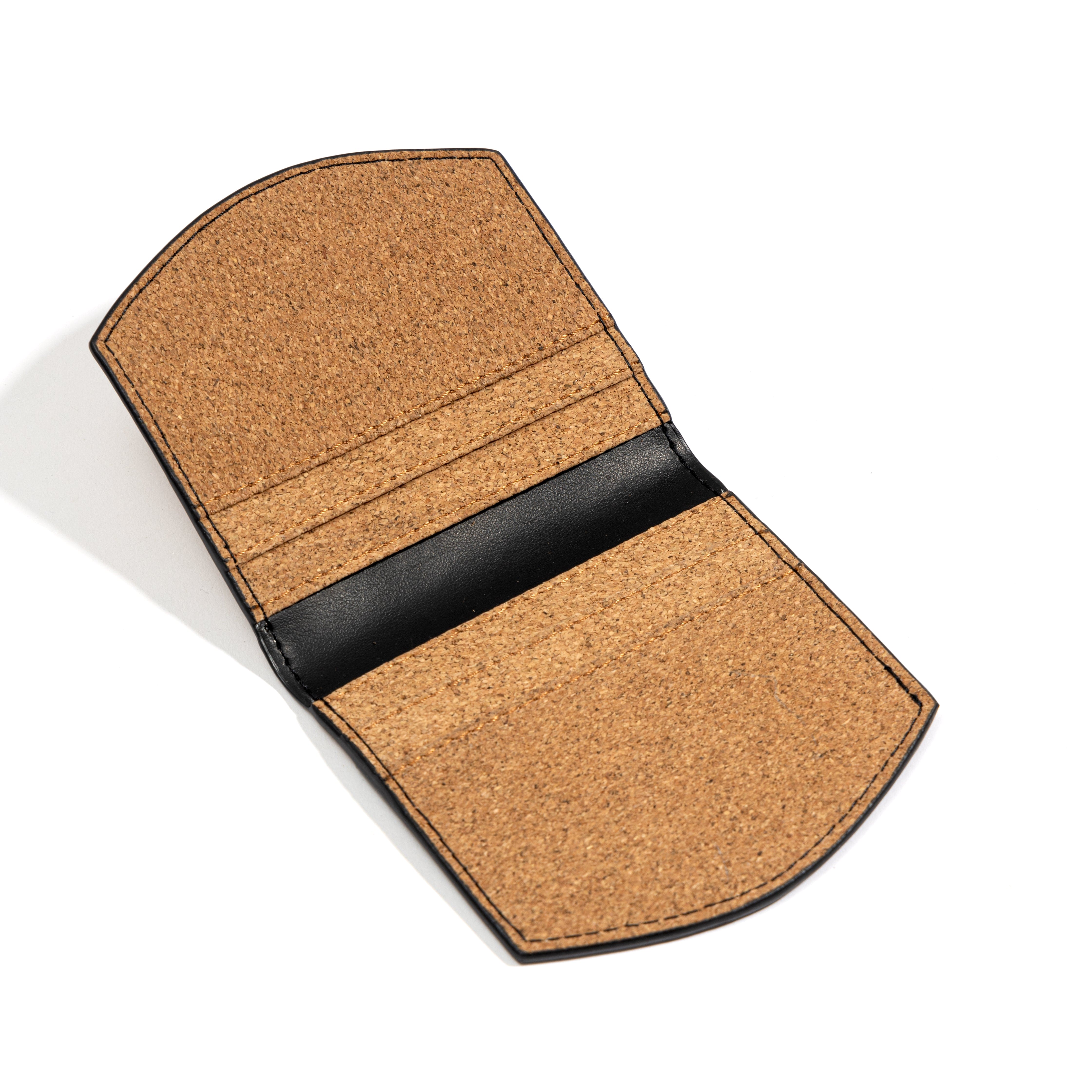 Plant leather card holder with geometric motif holding cards – Green Hermitage