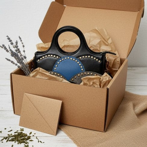 Savannah Black plant leather sling bag displayed in eco friendly packaging box by Green Hermitage