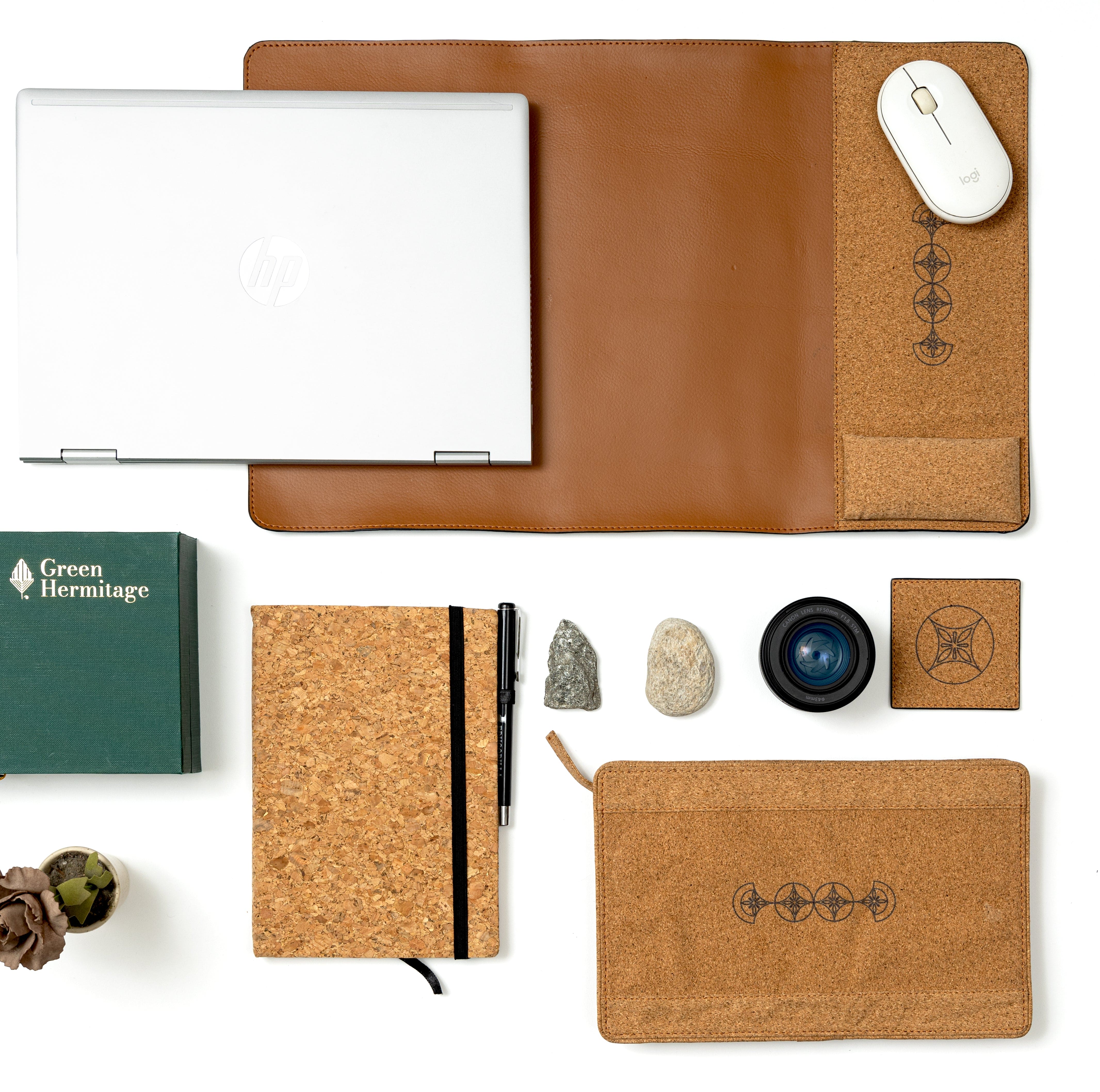 Tan office desk set by Green Hermitage featuring plant leather desk mat, cork diary with pen, coaster and tech organiser arranged on workspace